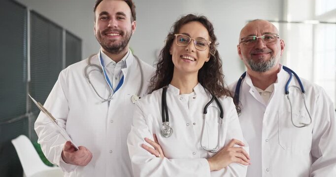 Doctors team smiling medical healthcare professionals portrait. Confident physicians at hospital clinic symbolizing teamwork, expertise and patient care. Ideal for trust staff and teamwork.