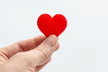 Obraz premium Hand Holding Red Heart Shape