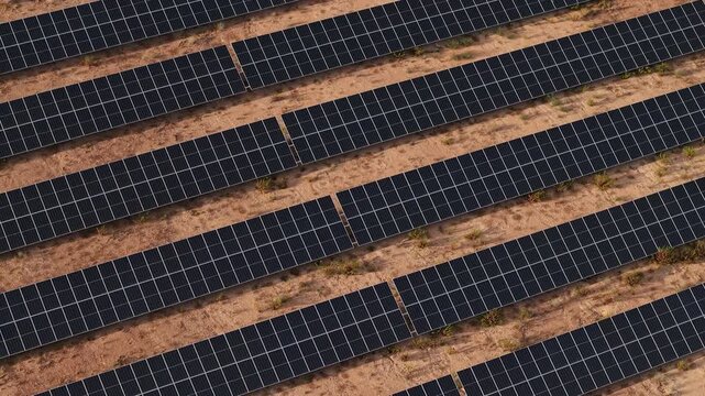 Aerial view of solar panel rows in dry landscape near Benidorm highlighting renewable energy production and sustainable technology