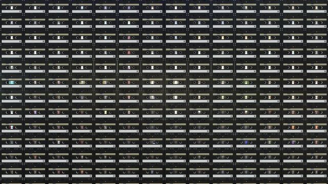 Seamless Loop of Retro Audio Cassette Wall: Mixed White Black and Stylized Cartoon Tapes for Music Visualizers and Nostalgic Backdrops
