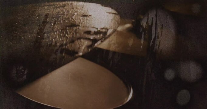 Camera shifting right and down, revealing stacked metallic discs for cinematic use, droplets, rim