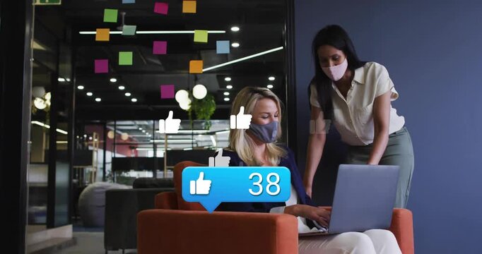 Colleagues in business lounge, woman typing on laptop, animated likes reaching 95 as social proof