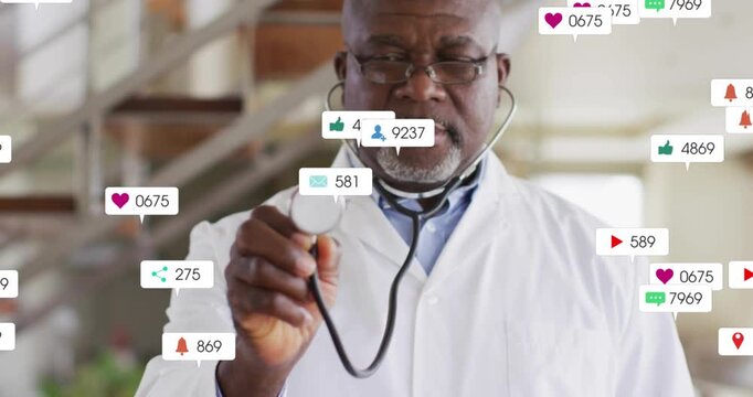 Senior physician moving chestpiece forward causing icons growing around chest showing buzz fading