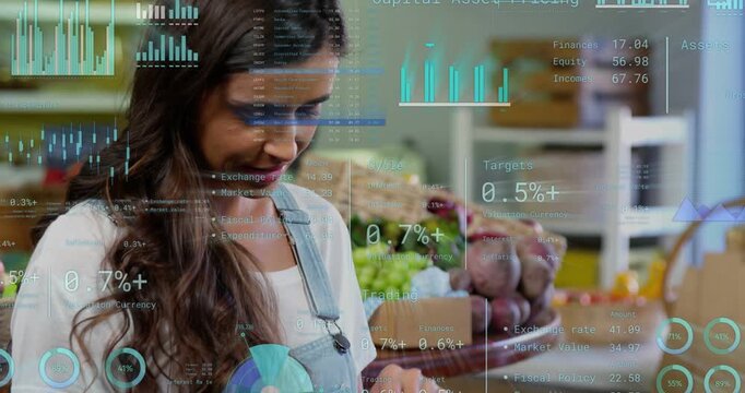 Vendor tapping tablet, causing charts over produce, reviewing sales, camera centering smiling