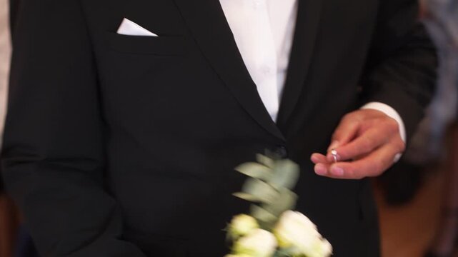 Closeup the intimate moment of bride and groom exchanging wedding diamond rings during wedding ceremony. Beautifully symbolizes love, commitment, and beginning of lifelong journey together