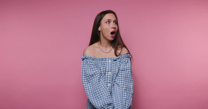 Expressions of surprise and confusion during a series of reactions in a studio setting on a pink background