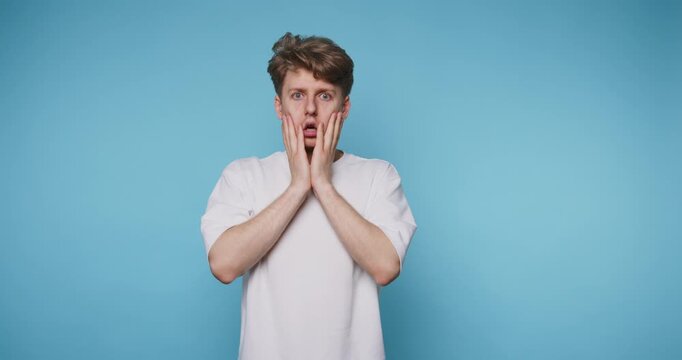 Man expresses different emotions in front of a blue wall in four frames during a short moment