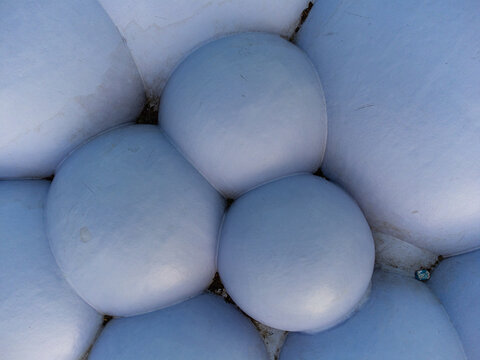 Aerial view of the smooth, rounded shapes, forming a cohesive whole with their subtle shadows and light, Utopia, Almere, Flevoland, Netherlands.