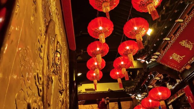 Shanghai, China, Interior of Buddhist Temple in Yuan Old Street. Chinese Lanterns and Golden Carved Painting
