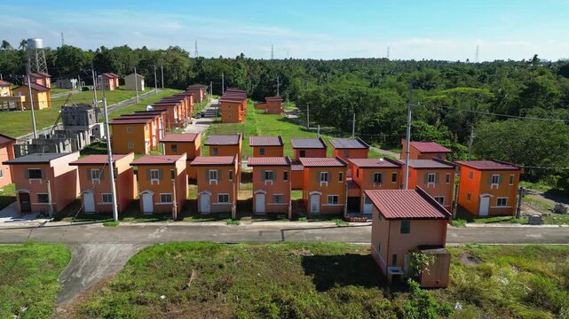 High rotating aerial revealing neighborhood symmetry at Camella Homes Alfonso Cavite Philippines