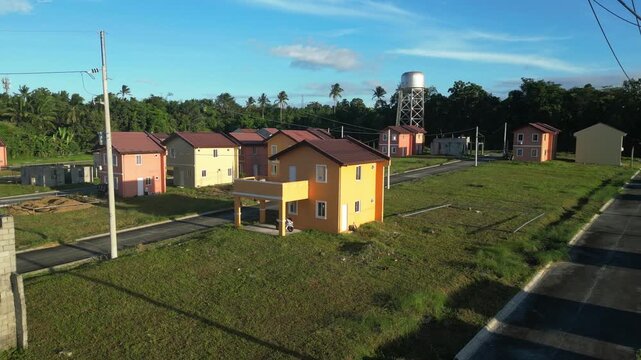 Side glide shot parallel to rows of houses at Camella Homes Alfonso Cavite Philippines