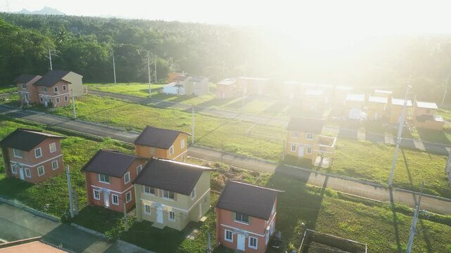 Low angle shot emphasizing houses against bright sky at Camella Homes Alfonso Cavite Philippines