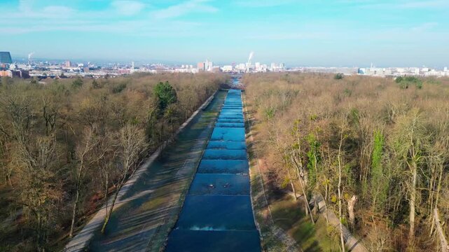 Smooth aerial drone flight over the River Wiese at the Swiss-German border, showcasing scenic riverside landscapes and cross-border surroundings.