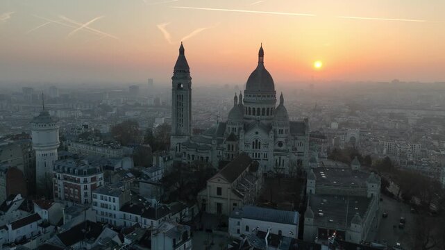 orbiting drone shot of a tourist landmark in the morning in Montmartre, Paris, aerial view of capital of France, Paris. 