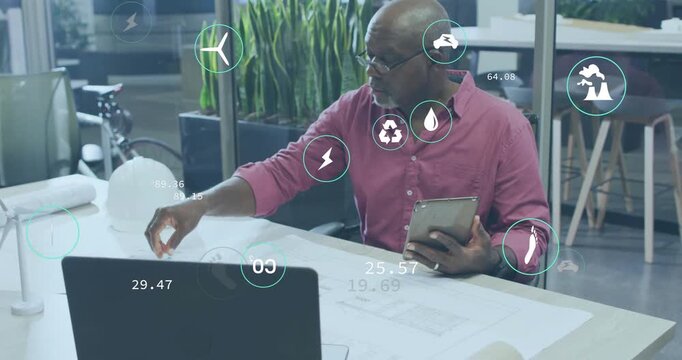 Animation icons over african american male architects holding digital tablet and preparing blueprint