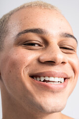 Fototapeta premium Handsome stylish man exuding confidence with a charming smile in a bright and modern setting