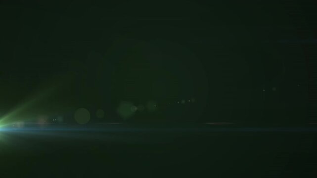 Digital animation of spot of light against copy space on green background
