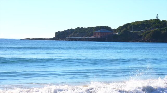 Historic wharf building on headland overlooking ocean, Tathra, New South Wales, Australia.