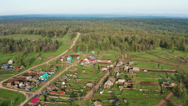 Southern Urals in spring: mountainous Bashkir village of Kyzlar-Birgan. Aerial view.