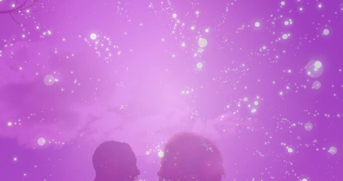 Animation of light spots over couple embracing