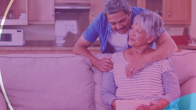 Animation of shapes over senior couple using tablet