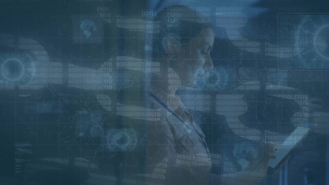 Female IT technician checks server data on a tablet.