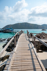 Fototapeta premium Exploring serene coastal pathway tropical island travel photo sunny environment landscape viewpoint
