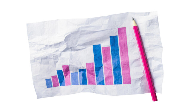 Wrinkled paper graph displaying blue pink bars, resting beside a red pencil