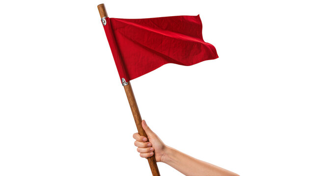 Human hand firmly grasping a waving red flag attached to a wooden pole