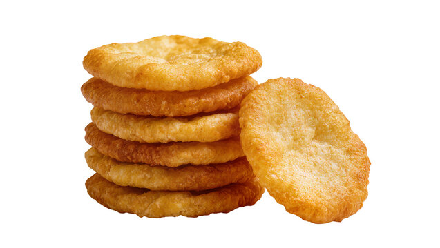 Stacked golden brown rye crackers, and one leaning slightly beside them