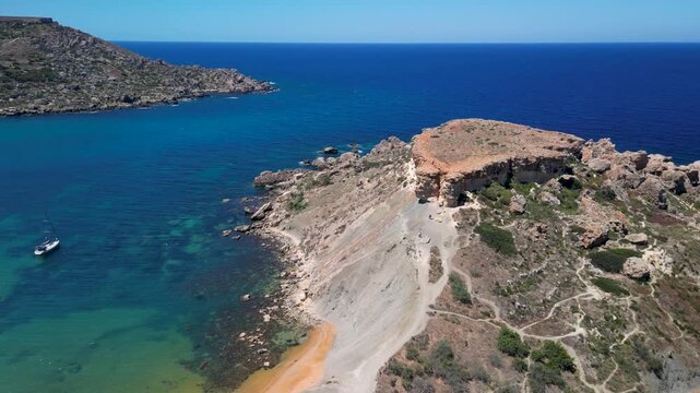 drone view of Malta west coast, Qarraba Bay and Għajn Tuffieħa, rocky cliffs and hidden beaches