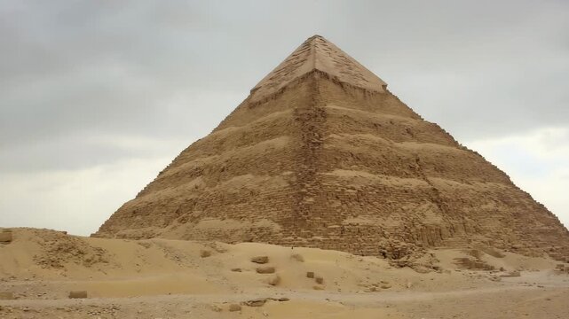 Ancient Egyptian Pyramid Ruins in Desert Landscape, Eroded Stone Blocks, Historical Monument, Travel Photography, Archaeological Site.