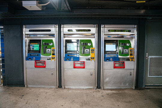New York City, New York, USA - 08.03.2024: MetroCard vending machines line the wall inside a New York City subway station. The automated machines provide tickets and fare payment for public