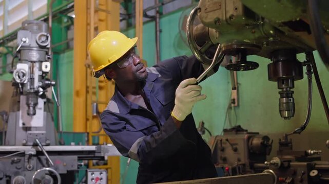 Industrial worker performing machinery maintenance in factory action-packed environment technical skills and precision focus