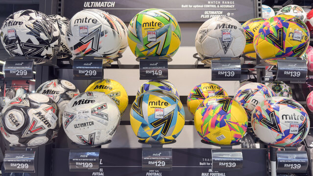 Colorful display of mitre footballs in a sports store in Penang, Malaysia