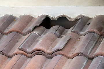 Damaged old roof tile in need of repair. © toa555