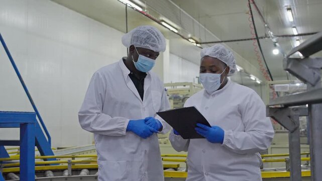Collaboration in food safety audits manufacturing facility professional meeting cleanroom environment close-up viewpoint industry standards