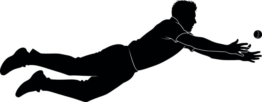 Silhouette of a man diving to catch a ball in mid air
