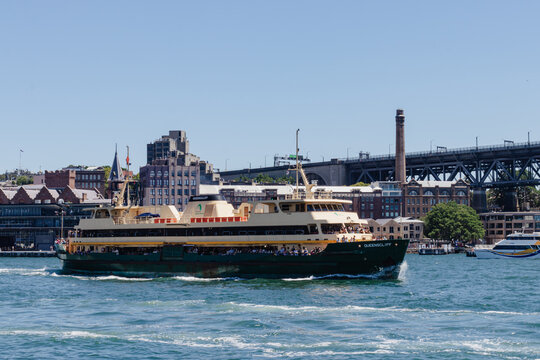 February 10, 2019, Sydney, Australia - The Queenscliff ferry carrying passengers on Sydney Harbour with city buildings and the Sydney Harbour Bridge in the background