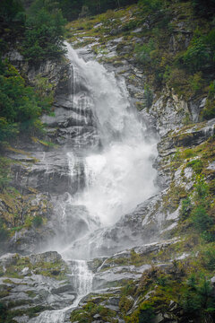 Ri di Cranz&uuml;nasc waterfall cascades through misty Val Bavona, Katon Tessin, Switzerland, ideal for travel