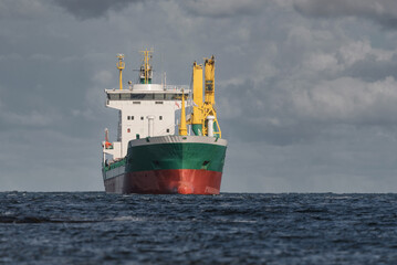 GENERAL CARGO SHIP - A freighter sails to sea