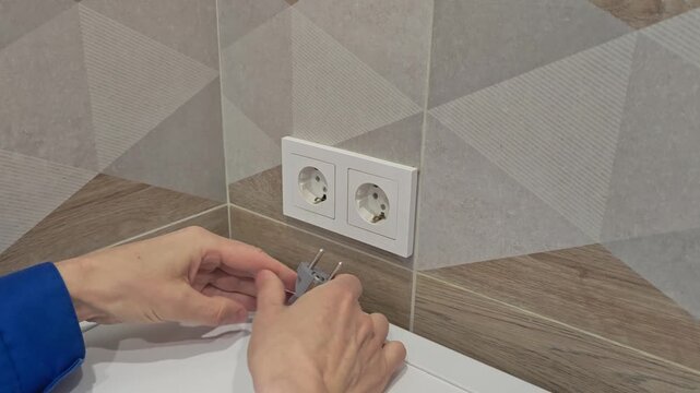 How to safely connect and disconnect a power cord in a home setting