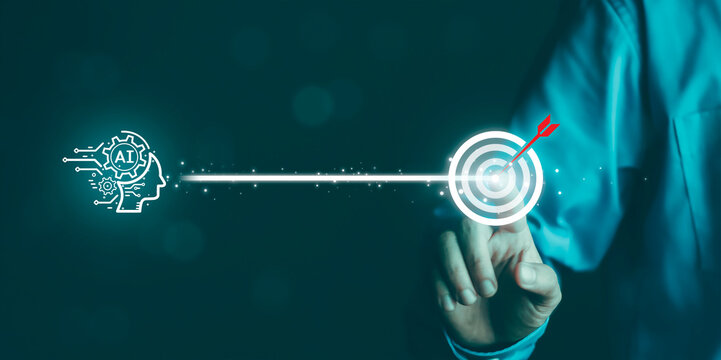 AI driven automation, data analysis, and smart decision making for achieving business objectives and performance growth. Business hand connecting artificial intelligence system to target goal.