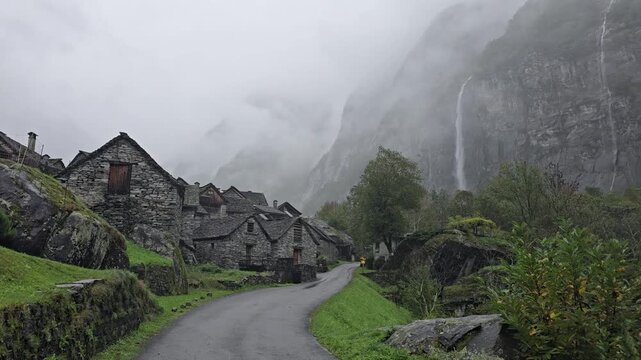 Rain and mist surround Sonlerto village in Val Bavona, Ticino, Switzerland, ideal for travel