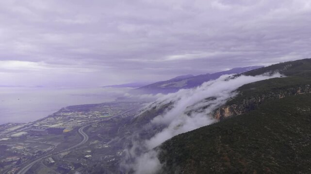 Cinematic Fog Rolling Over Mountains Towards Iskenderun Coastline | 4K Drone Footage