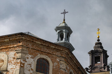 Fototapeta premium Ancient Dominican monastery with bell tower and Virgin Mary column in Pidkamin