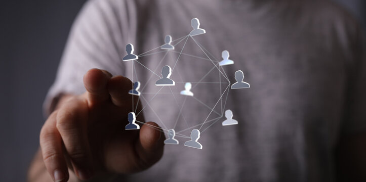 Person points to a network of people, representing connection, communication, and social media. Ideal for business, tec