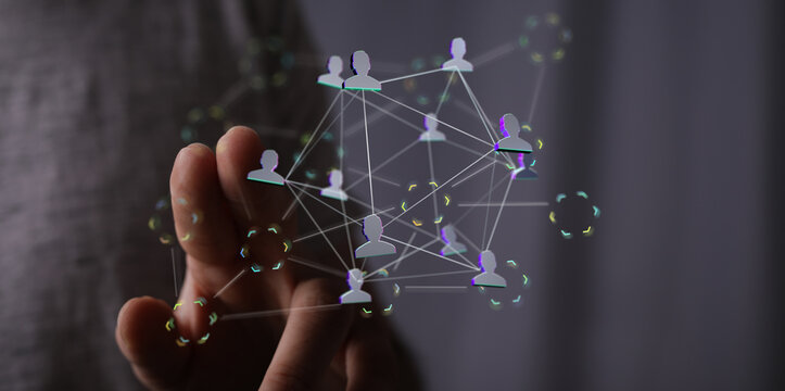 Abstract image showing a hand interacting with a digital network, representing concepts like connection, technology, so