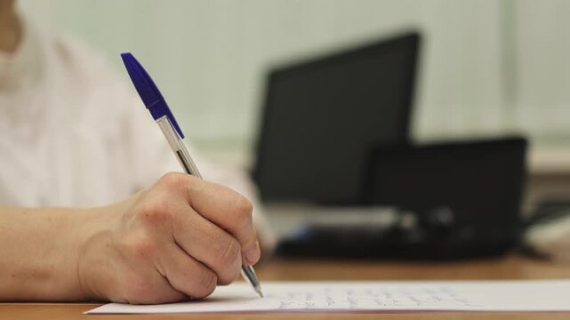 Doctor's visit. Notes in a notebook. Pen. Slow motion. . High quality 4k footage