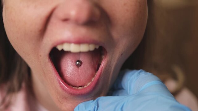 Open your mouth. ENT doctor. Doctor's appointment. Slow motion. . High quality 4k footage